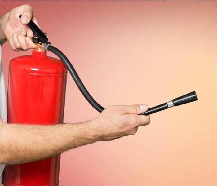 Man using fire extinguisher